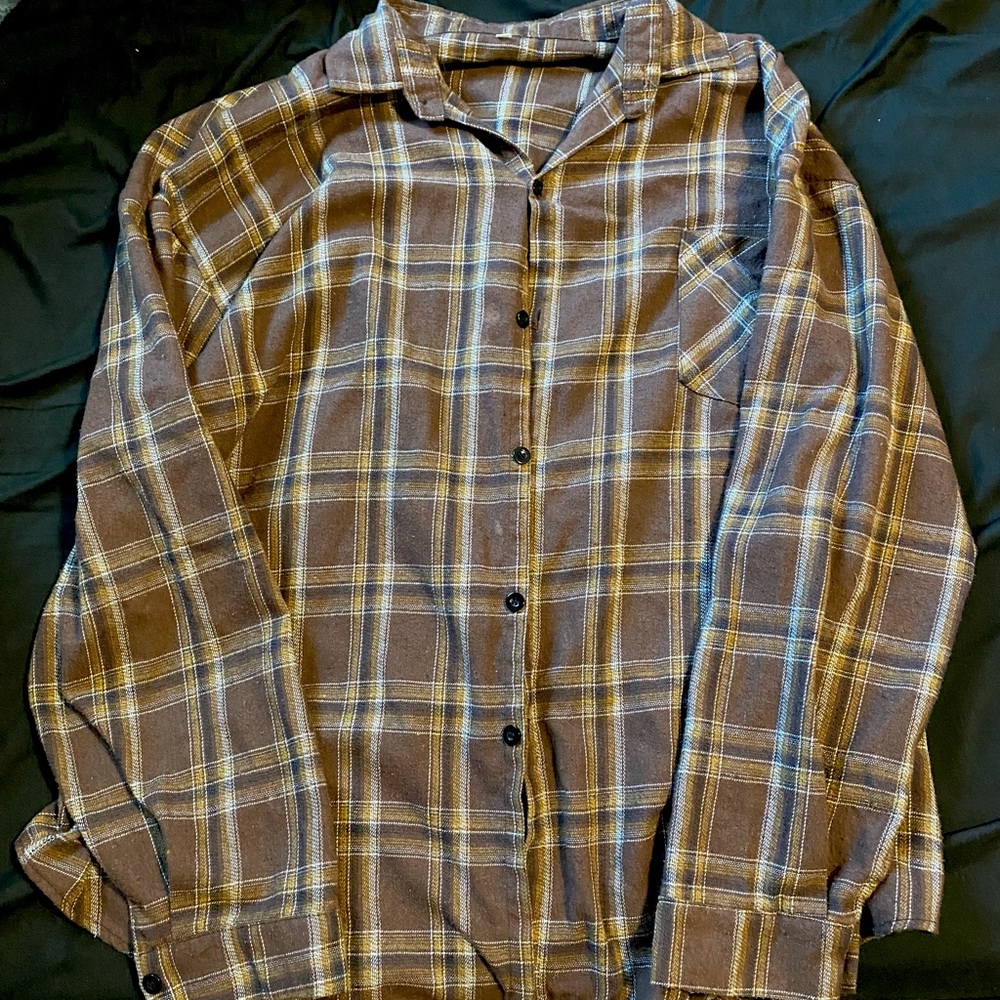 woman’s plaid button up long sleeved brown sweater